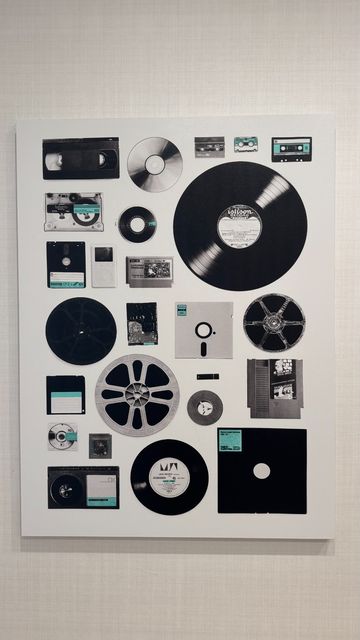 Different forms of (outdated) media storage from LPs to various floppy disk formats, VHS tape, an SNES cartridge, and an iPod.