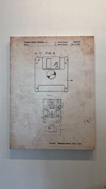 The patent for the 3.5" floppy on a canvas.