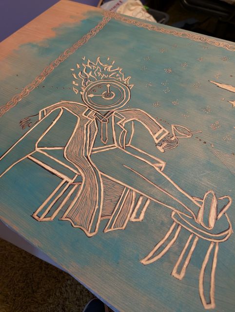 Clock headed figure carved into a teal tinted sheet of wood