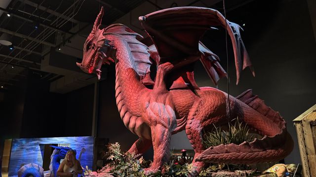 An animated sculpture of a red dragon at the Sloan Museum.
